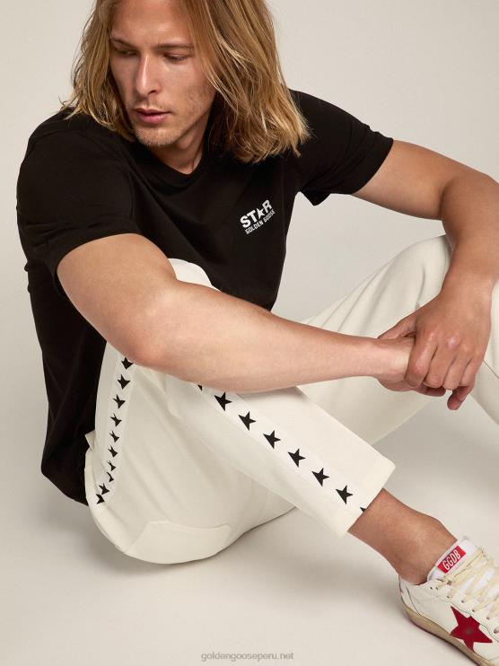 FDVPX690 Golden Goose hombres camiseta negra de la colección star con logo y estrella en contraste en blanco