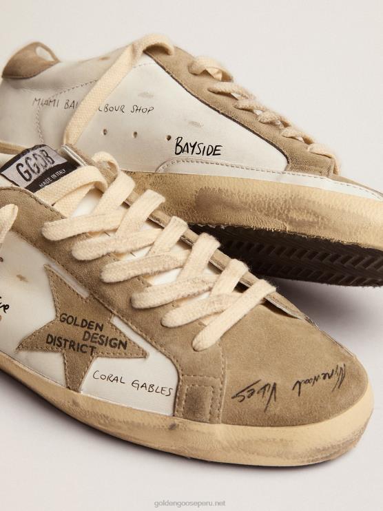FDVPX511 Golden Goose hombres zapatillas super-star de piel blanca con inserciones de ante gris tórtola y letras negras por toda la superficie