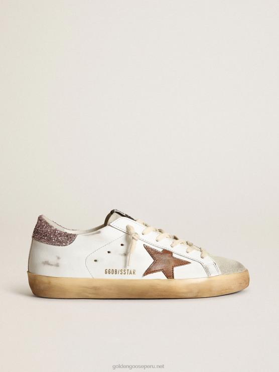 FDVPX201 Golden Goose mujer superestrella con una estrella color canela y una lengüeta rosa brillante en el talón