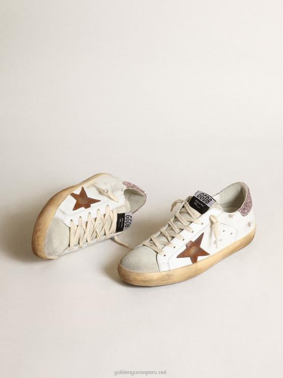FDVPX201 Golden Goose mujer superestrella con una estrella color canela y una lengüeta rosa brillante en el talón