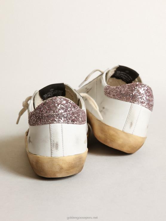 FDVPX201 Golden Goose mujer superestrella con una estrella color canela y una lengüeta rosa brillante en el talón